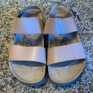 Gently worn tan sandals